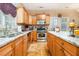 Updated kitchen features granite countertops, stainless steel appliances, and wooden cabinets at 11 Tallulah Ct, Jonesboro, GA 30236