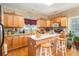 Cozy kitchen with granite countertops, island seating, and warm wood cabinets at 11 Tallulah Ct, Jonesboro, GA 30236