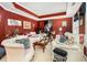Elegant living room with red walls, white trim, and plush seating at 11 Tallulah Ct, Jonesboro, GA 30236