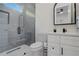 Modern bathroom with a glass-enclosed shower, sleek vanity, and elegant finishes at 2014 Cambridge Ave, Atlanta, GA 30337