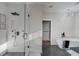 Stylish bathroom featuring a glass shower, freestanding tub, and modern fixtures at 2014 Cambridge Ave, Atlanta, GA 30337