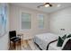 Bright bedroom with hardwood floors, neutral walls, and comfortable bed at 2014 Cambridge Ave, Atlanta, GA 30337