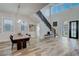 Elegant dining area with contemporary decor, modern light fixtures, and seamless access to outdoor views at 2014 Cambridge Ave, Atlanta, GA 30337