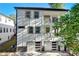Modern two-story home featuring a double garage and balconies on both levels, a stylish and functional design at 2014 Cambridge Ave, Atlanta, GA 30337