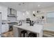 Bright and modern kitchen with white cabinetry, stainless steel appliances, and a stylish center island at 2014 Cambridge Ave, Atlanta, GA 30337