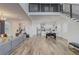 Bright open-concept interior with hardwood floors, a spacious living area, dining space, and a modern kitchen at 2014 Cambridge Ave, Atlanta, GA 30337