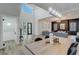 Bright living area with soaring ceilings, hardwood floors, and open layout; dining room area on the right at 2014 Cambridge Ave, Atlanta, GA 30337