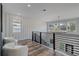 Bright and airy loft space with decorative lighting and sleek metal railings at 2014 Cambridge Ave, Atlanta, GA 30337