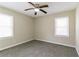 Comfortable bedroom with neutral walls, carpet, ceiling fan, and natural light from two windows at 2818 Mcafee Rd, Decatur, GA 30032
