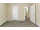 Bedroom featuring neutral walls and plush carpeting with access to hallway and closet at 2818 Mcafee Rd, Decatur, GA 30032