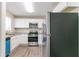 Well-lit kitchen featuring modern appliances, including a stainless steel refrigerator at 2818 Mcafee Rd, Decatur, GA 30032