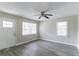 Living room featuring new vinyl floors, a ceiling fan, and plenty of natural light at 2818 Mcafee Rd, Decatur, GA 30032