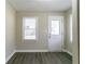 Bright room with new floors and a door to the exterior at 2818 Mcafee Rd, Decatur, GA 30032