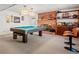 Recreational basement with a pool table, a fireplace, and a bar, perfect for entertainment and relaxation at 301 Millbrook Farm Ct, Marietta, GA 30068