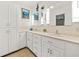 Bright bathroom featuring double sinks, ample counter space, and modern fixtures at 301 Millbrook Farm Ct, Marietta, GA 30068