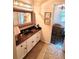 Bathroom featuring a sink, vanity with granite counter, and decorative mirror at 301 Millbrook Farm Ct, Marietta, GA 30068