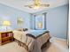Comfortable bedroom with a ceiling fan, a window, and a serene ambiance, perfect for relaxation and restful sleep at 301 Millbrook Farm Ct, Marietta, GA 30068