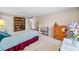 Cozy bedroom boasts built-in shelving, a four-poster bed, and a view into an adjacent room, providing functionality and charm at 301 Millbrook Farm Ct, Marietta, GA 30068
