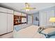 Bright bedroom with a ceiling fan, ensuite bathroom, built-in wardrobes, and plenty of natural light at 301 Millbrook Farm Ct, Marietta, GA 30068