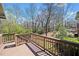 Deck with wooden railings and overlooking landscaped backyard at 301 Millbrook Farm Ct, Marietta, GA 30068