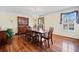 Formal dining room with hardwood floors, wainscoting, and a chandelier over a dining table set for six at 301 Millbrook Farm Ct, Marietta, GA 30068