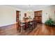 Elegant dining room featuring hardwood floors, chandelier, and a classic china cabinet at 301 Millbrook Farm Ct, Marietta, GA 30068