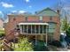 View of the brick exterior, wood deck, and screened-in porch of the home at 301 Millbrook Farm Ct, Marietta, GA 30068