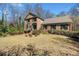 Charming two-story brick home with manicured lawn and mature landscaping at 301 Millbrook Farm Ct, Marietta, GA 30068