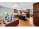 A kitchen and eating area featuring wood cabinets, granite countertops, and a black island at 301 Millbrook Farm Ct, Marietta, GA 30068