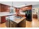 Beautiful kitchen features a center island, stainless steel appliances, and wood cabinetry at 301 Millbrook Farm Ct, Marietta, GA 30068