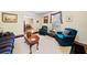 Classic living room with comfortable blue armchairs and view to the dining room at 301 Millbrook Farm Ct, Marietta, GA 30068