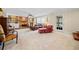 Living room with a brick fireplace, built-in bookshelves, and large windows at 301 Millbrook Farm Ct, Marietta, GA 30068