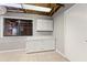 Basement laundry area with utility sink, storage and tiled floors at 326 Bethel Dr, Woodstock, GA 30189