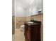 Bathroom featuring a classic vanity with granite countertop and decorative tile walls at 326 Bethel Dr, Woodstock, GA 30189
