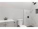 This bathroom has a tile surround shower, toilet, modern vanity, and updated fixtures at 326 Bethel Dr, Woodstock, GA 30189