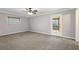 Carpeted bedroom with ceiling fan, a walk-out door to a deck, and a window at 326 Bethel Dr, Woodstock, GA 30189