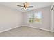 Bedroom featuring a window, carpet, neutral walls, and ceiling fan at 326 Bethel Dr, Woodstock, GA 30189
