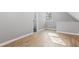 This bedroom features hardwood floors, a window, neutral walls, and an attached bathroom at 326 Bethel Dr, Woodstock, GA 30189