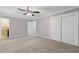 Spacious bedroom with neutral walls, carpet, ceiling fan and closet at 326 Bethel Dr, Woodstock, GA 30189