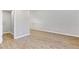 Bonus room with wood flooring, light grey walls, and access to an additional space at 326 Bethel Dr, Woodstock, GA 30189