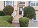 Charming front entrance featuring a decorative door, manicured shrubs, and a welcoming walkway at 326 Bethel Dr, Woodstock, GA 30189