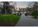 Traditional-style house with manicured lawn, mature trees, and long driveway at 326 Bethel Dr, Woodstock, GA 30189