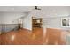 Open concept living area with hardwood floors, stairs, and a view of the kitchen at 326 Bethel Dr, Woodstock, GA 30189