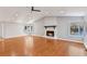Bright living room with vaulted ceilings, hardwood floors, and a stone fireplace at 326 Bethel Dr, Woodstock, GA 30189
