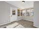 Sunroom with windows, blinds, an exit door, neutral walls, and carpet at 326 Bethel Dr, Woodstock, GA 30189