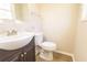 Bathroom featuring a vessel sink and wood-look flooring at 8684 Chestnut Ln, Lithia Springs, GA 30122