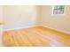 Bedroom with hardwood floors, natural light and cream painted walls at 8684 Chestnut Ln, Lithia Springs, GA 30122