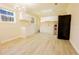 Well-lit kitchen with white cabinets, stainless steel appliances, and vinyl flooring at 8684 Chestnut Ln, Lithia Springs, GA 30122