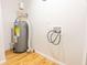 Image of a utility room with a water heater and exposed connections at 8684 Chestnut Ln, Lithia Springs, GA 30122