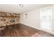 Cozy living room featuring a stone fireplace and hardwood floors at 2379 Ridgeway Dr, Atlanta, GA 30360